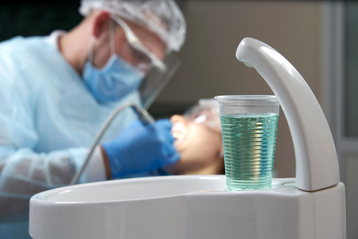 Illustration of enamel being removed from a tooth for veneer placement
